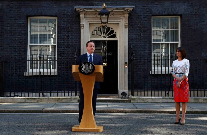 British Prime Minister David Cameron announces he will be stepping down after the U.K. voted to leave the European Union, as his wife Samantha watches outside Number 10 Downing Street on Friday.