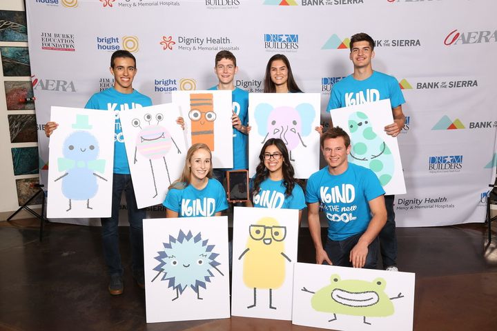 High school students in the Dream Builders program show off the characters they created to encourage children to practice being kind to others.