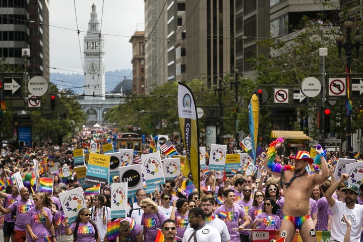 The theme of San Francisco's Pride parade this year is "For Racial and Economic Justice," but community groups say an increased police presence doesn't reflect that theme. Above, people march in last year's parade in the city. 