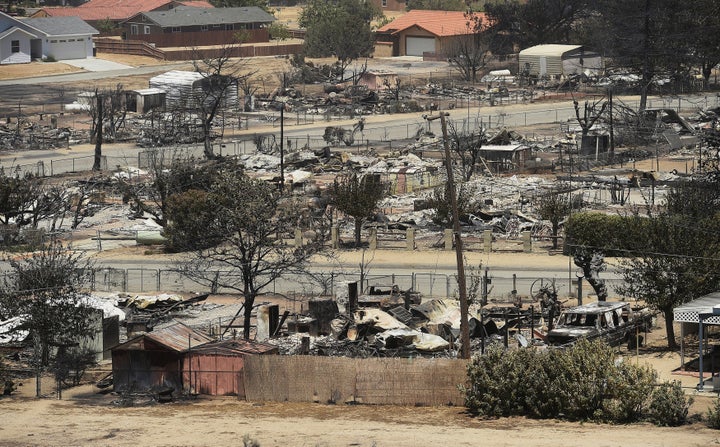 The remains of scorched homes line a street after the Erskine Fire burned through South Lake, California, U.S. June 24, 2016.