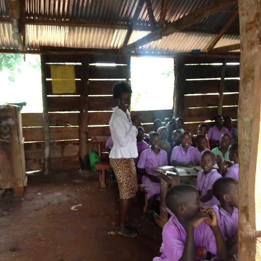 Helen Salaamu (graduate & member of the One Village alumni Scholarship) teaching at her primary school