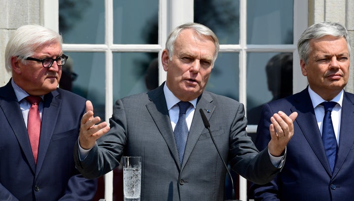 France's Foreign minister Jean-Marc Ayrault (C) speaks flanked by Germany's Foreign minister Frank-Walter Steinmeier (L) and Belgium's Foreign minister Didier Reynders.