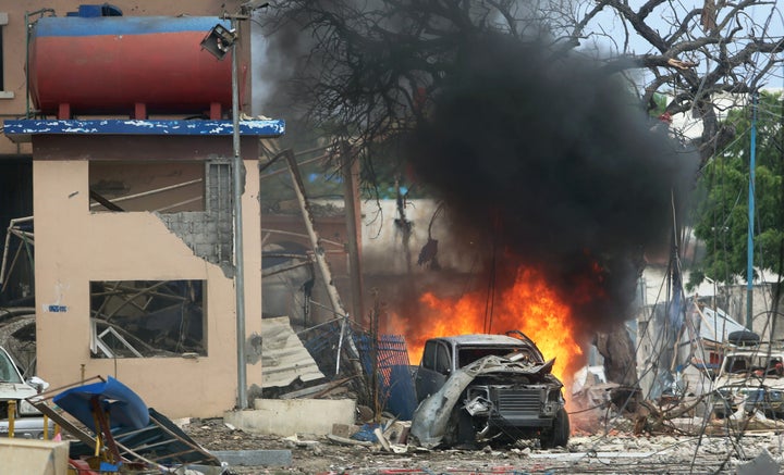 A vehicle burns at the scene of a suicide bomb attack outside Nasahablood hotel in Somalia's capital Mogadishu, June 25, 2016.