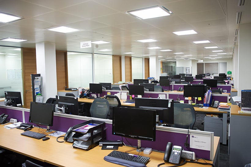 The on-brand, logo-purple dividers don't matter much when the office is this ugly.