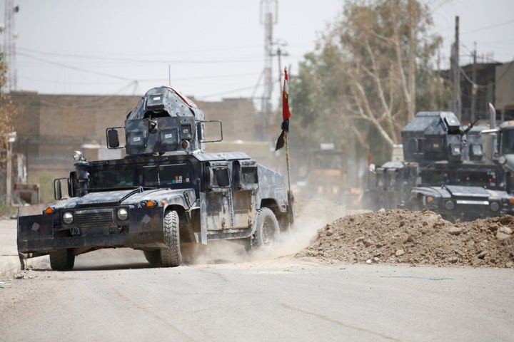 Military vehicles of Iraqi security forces are seen in Falluja, Iraq, June 25, 2016. (REUTERS/Thaier Al-Sudani)