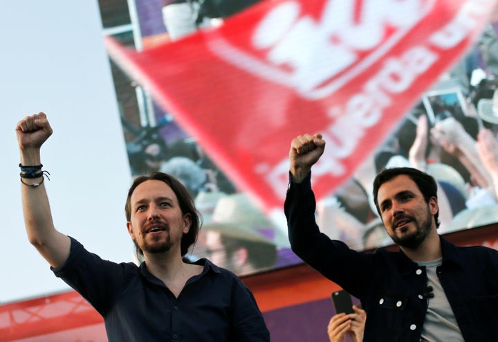 Podemos (We Can) leader Pablo Iglesias (L) and Izquierda Unida (United Left) leader Alberto Garzon.