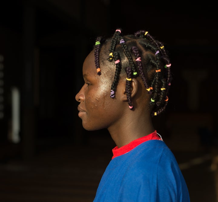 <em>When money is tight, girls will use all the false hair they can collect and from their friends to braid into their own hair.</em>