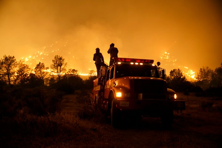 Firefighters from Cal Fire's Sonoma-Lake-Napa Unit pay close attention to the wildfire coming at every direction in Kelso Valley as the wildfire progresses east with the winds, near Lake Isabella, Calif., on June 24, 2016. (Photo by Marcus Yam/Los Angeles Times via Getty Images)