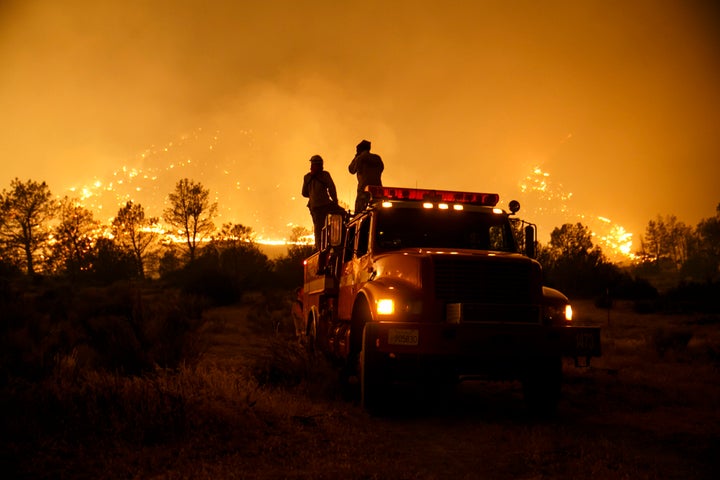 Firefighters from Cal Fire's Sonoma-Lake-Napa Unit pay close attention to the wildfire coming at every direction in Kelso Val