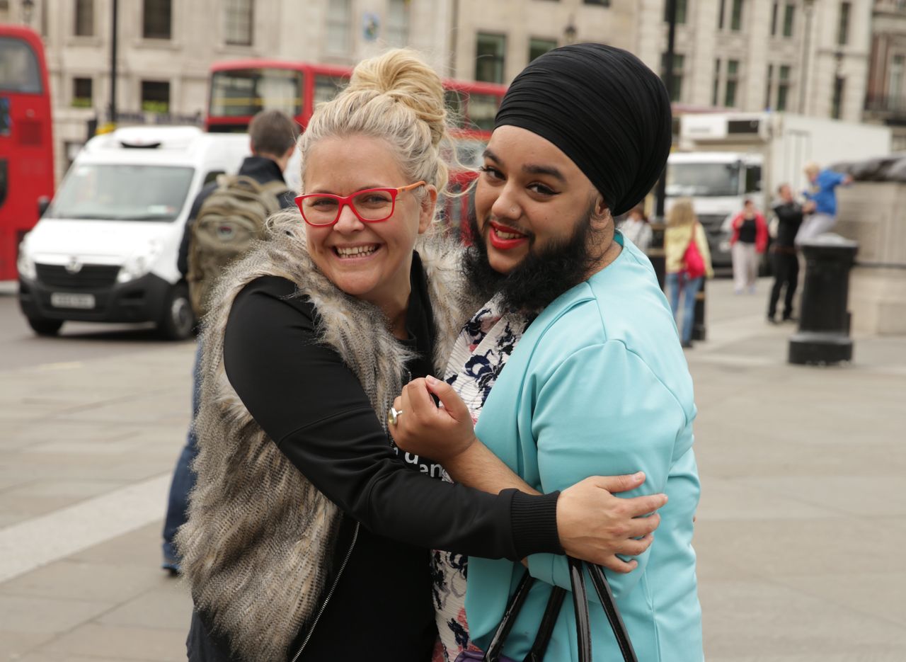 Taryn Brumfitt hugs Harnaam Kaur in the U.K. Kaur, also known as the "bearded dame," has polycystic ovary syndrome, a condition that can cause excessive hair growth. Kaur, who decided to ditch the razor and embrace her beard, is a body positivity advocate and model.