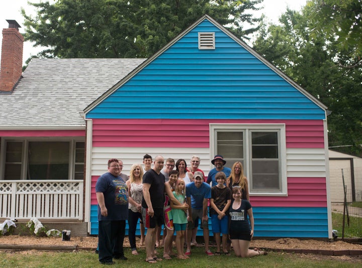 The Planting Peace crew in front of the newest addition to the Equality House compound.