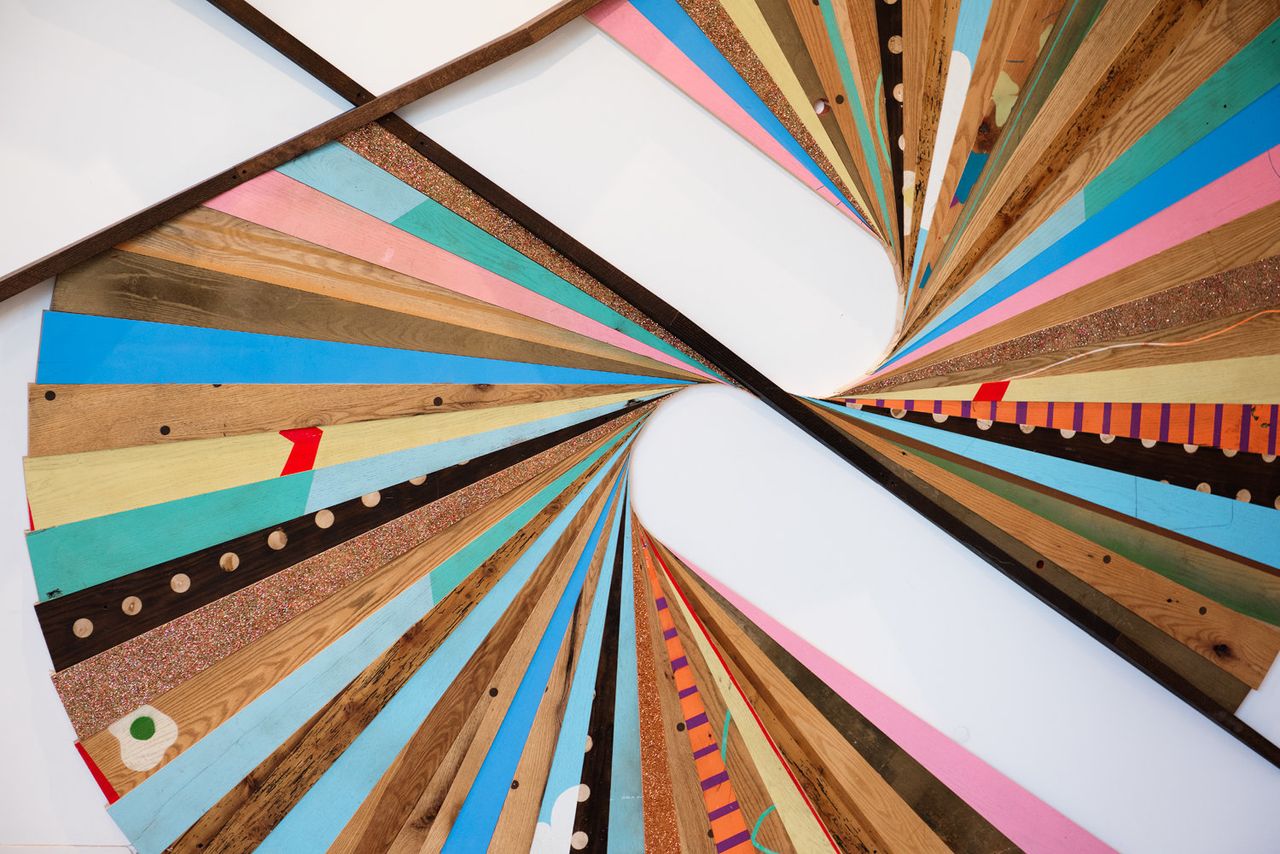 An art installation made from personalized desks from Etsy's former office.