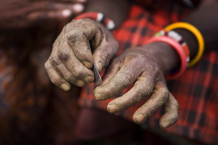 A Masaai villager displays the traditional blade used to circumcise young girls in Kenya.