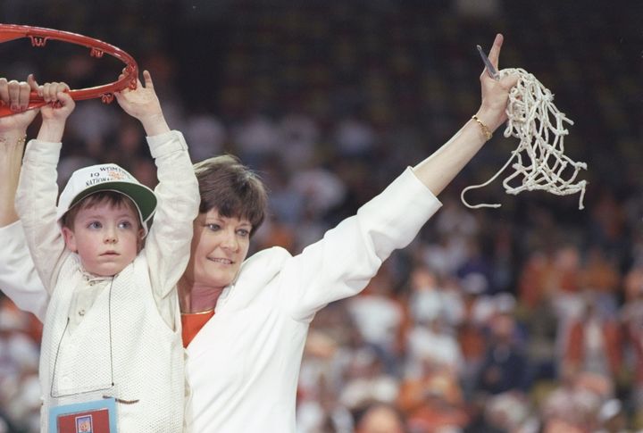 Summitt cuts with the net with the help of son Tyler after a Lady Vols playoff victory against the Old Dominion Monarchs at Riverfront Coliseum in Cincinnati on March 30, 1997.