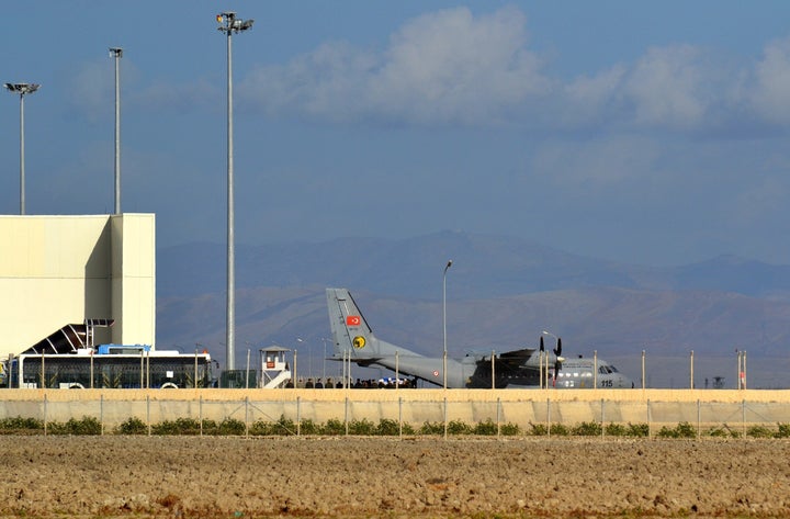 A Turkish cargo plane carries the body of a Russian pilot killed after Turkey downed a Russian fighter jet that Turkish officials claimed had violated the country's air space. Here, the plane transfers the Russian pilot's body to Ankara on Nov. 29, 2015.