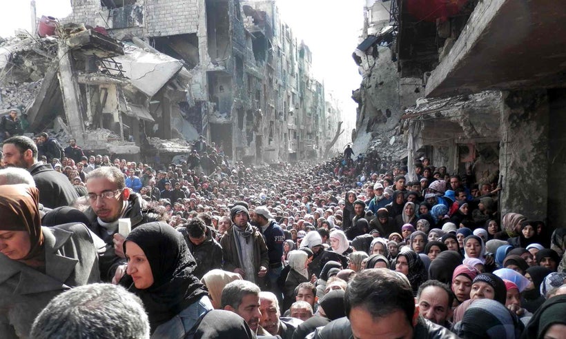 Syrian refugees at the Yarmouk Camp waiting for food, Damascus, Syria, 2014