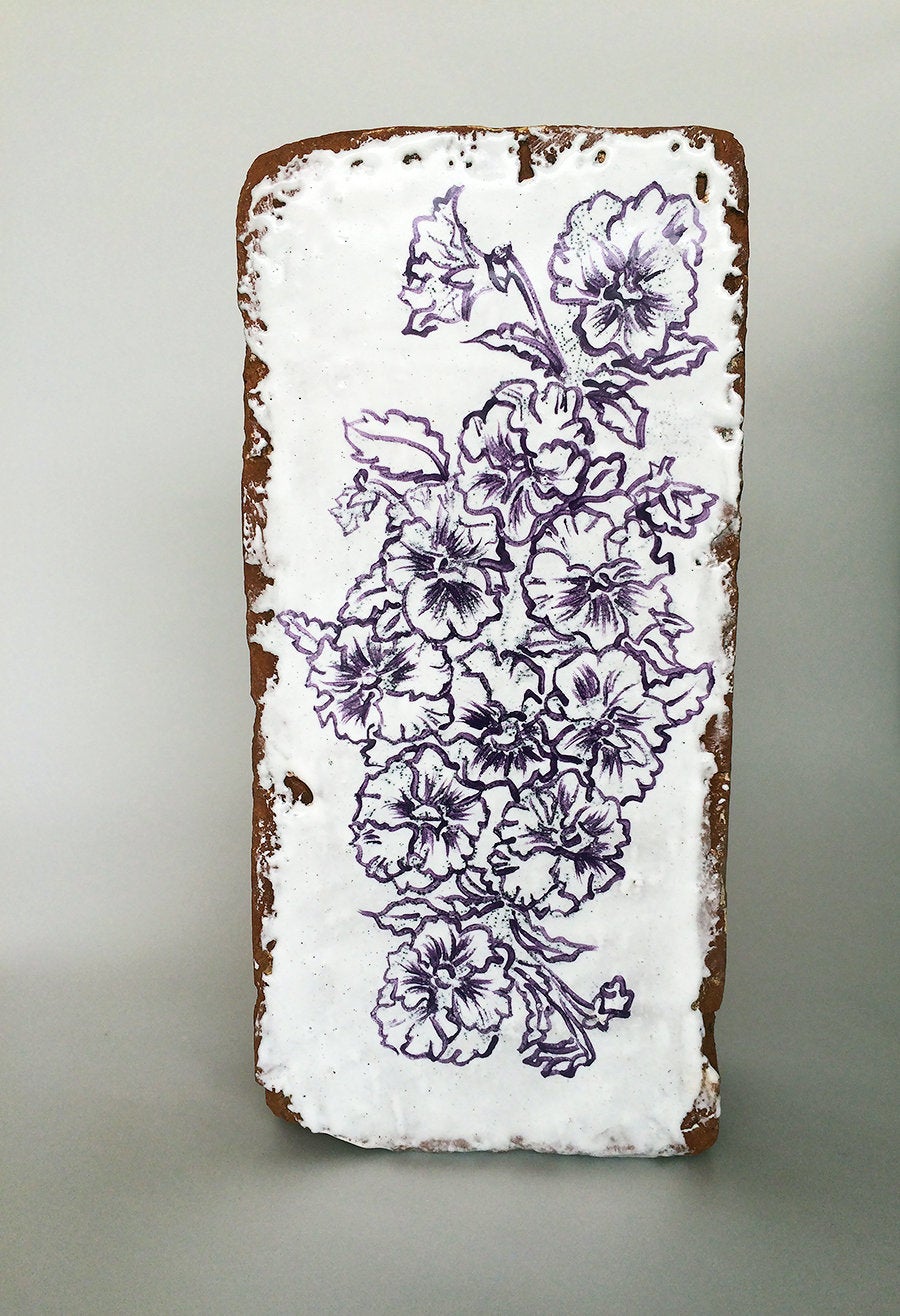 Nicki Green, Pansy Brick, 2015. Glaze on brick found in San Francisco.