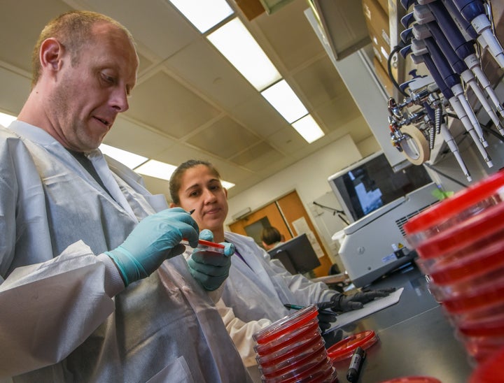 Scientists, like Dr. Patrick McGann, left, and Kathy 'Ana' Ong, have been testing bacteria for the antibiotic-resistant mcr-1 gene since it was discovered last year in China.