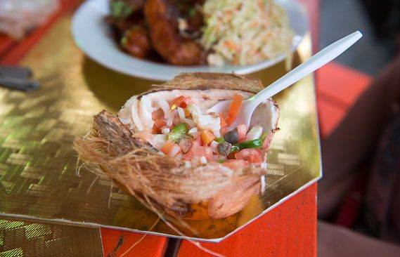 Conch salad, a local delicacy, served in coconut husk, at the Fish Fry, Arawak Cay, Nassau.