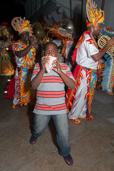 A member of the Marina Village Junkanoo group blows the conch shell.