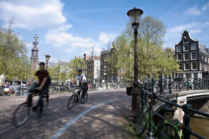 Cyclists crossing one of Amsterdam's many bridges.