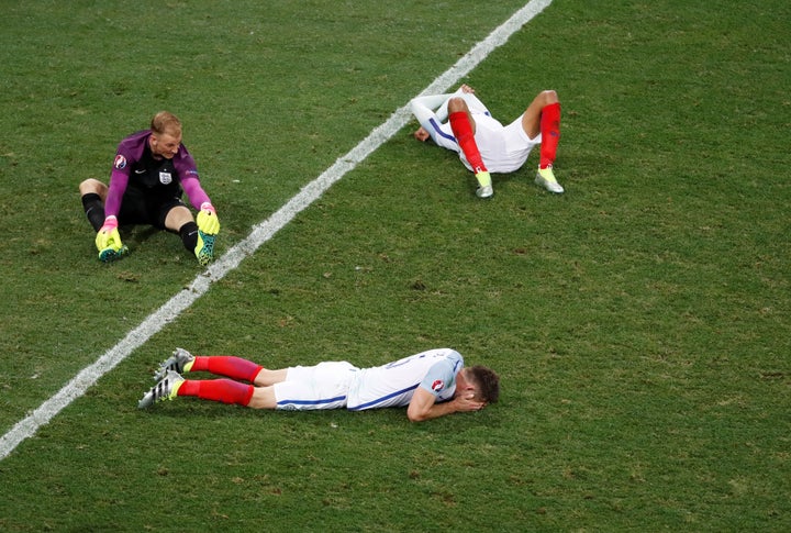 Several of England's soccer players, including goalkeeper Joe Hart (top left), are seen looking dejected after losing to Icel