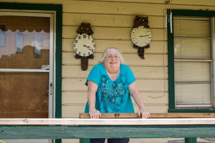 Susan Holmes on the front porch of her home in Bokoshe, Oklahoma.