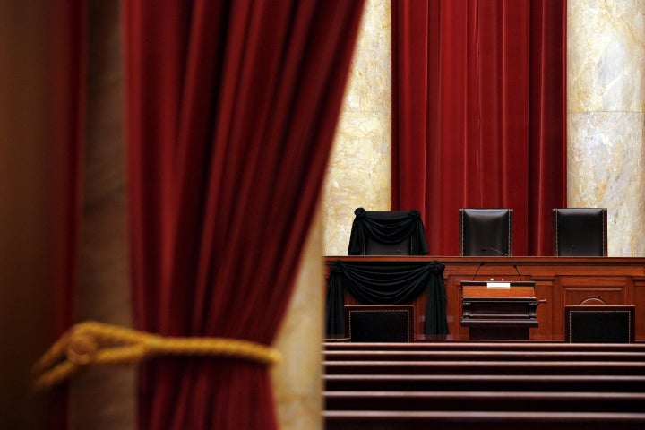 The bench of late Supreme Court Justice Antonin Scalia is seen draped with black wool crepe in memoriam inside the Supreme Co