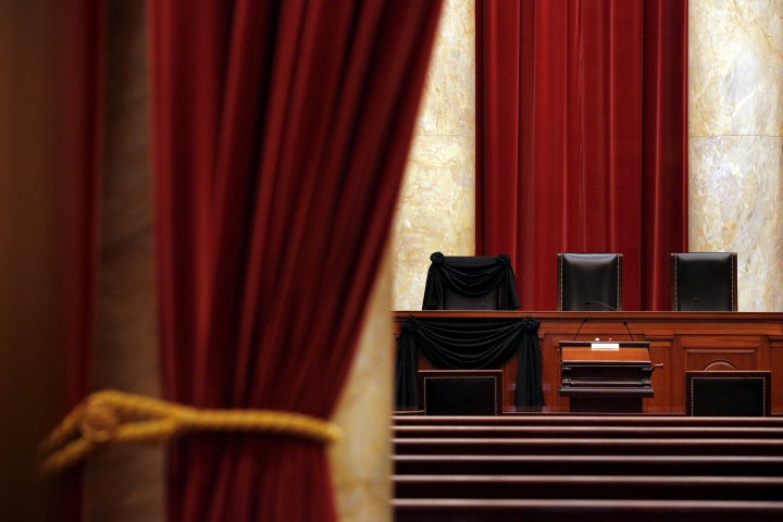 The bench of late Supreme Court Justice Antonin Scalia is seen draped with black wool crepe in memoriam inside the Supreme Court in Washington, Feb. 16, 2016.