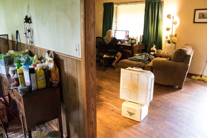 Bokoshe residents like Susan Holmes use creative methods to deal with airborne fly ash dust, such as this makeshift purifier made by taping an air filter to a box fan.