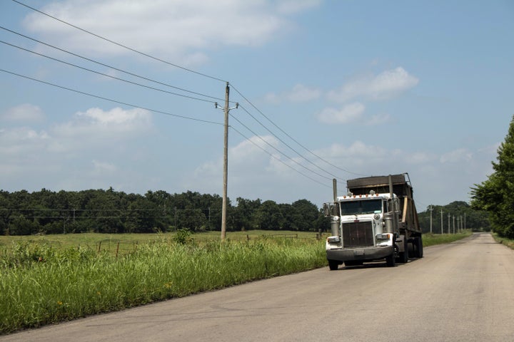 A truck filled with fly ash leaves the AES Shady Point generation plant near Panama, Oklahoma.