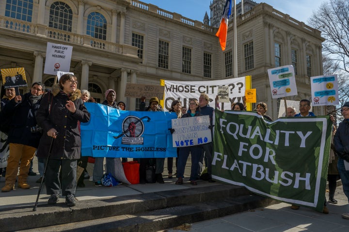 Activists from East Harlem and other neighborhoods rally against a major component of New York City Mayor Bill de Blasio's affordable housing plan at City Hall in March.