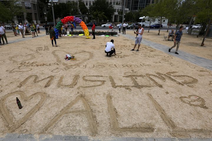 "Muslims Love All" is scratched into the ground at a makeshift memorial for the victims of the Pulse night club shooting in Orlando, Florida, U.S., June 19, 2016.