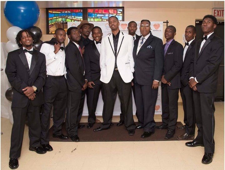 Attendees, striking a pose in their formalwear. 