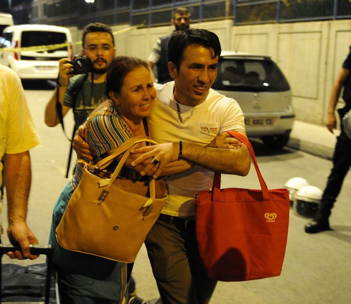 People leave Istanbul’s Ataturk Airport after an attack by suicide bombers.