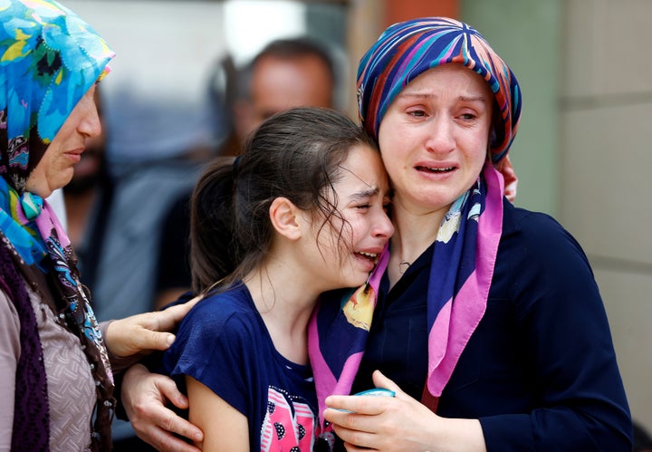 <i></i>Relatives of one of the victims of the blast at Istanbul Ataturk Airport mourn in front of a morgue in the Turkis
