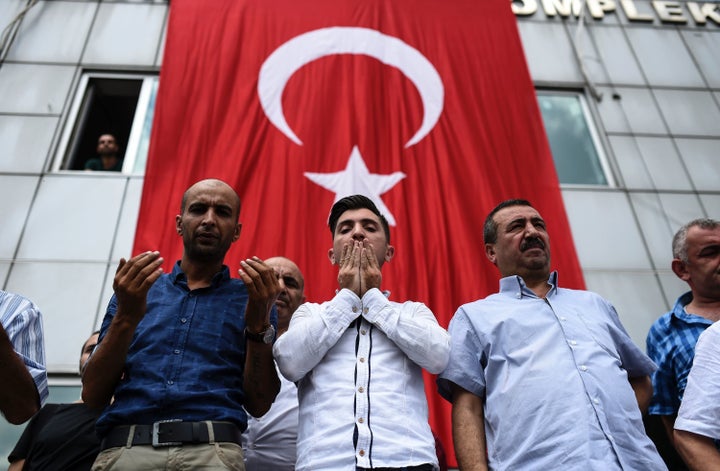 People mourn at the funeral of one of the victims of the Istanbul airport bombing.