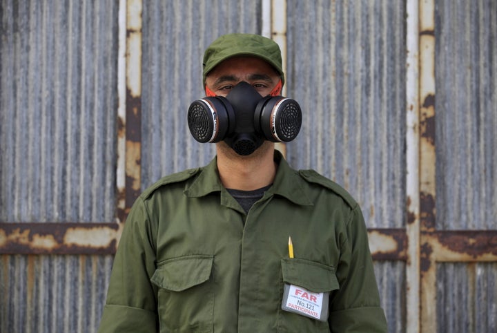 Eloy, 38, a Cuban military reservist who is working in a fumigation campaign against the <i>Aedes aegypti</i> mosquito,