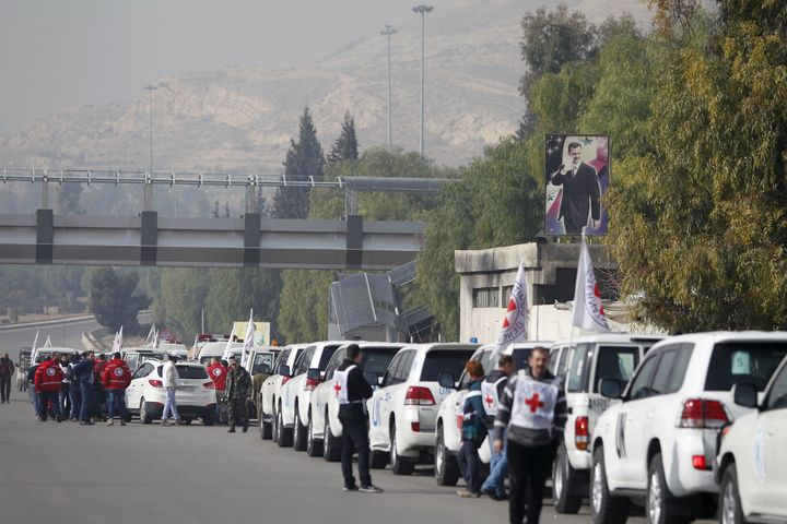 A convoy consisting of Red Cross, Red Crescent and United Nation (UN) gather before heading towards to Madaya from Damascus, and to al Foua and Kefraya in Idlib province, Syria January 11, 2016.