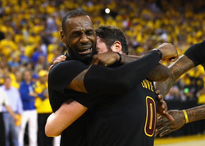 LeBron James and Kevin Love embrace after winning Game 7 of the 2016 NBA Finals. 