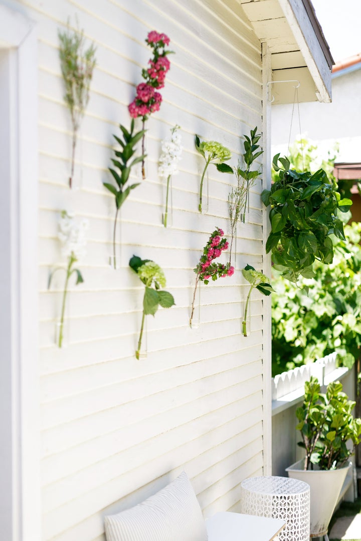 Beaker vases with farmers market clippings livened up the outdoor space. 