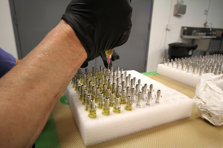 <em>Cartridges are filled with oil while in a warm state. The cartridges contain a heating cylinder that warms the oil into vapor when activated by the battery.</em>