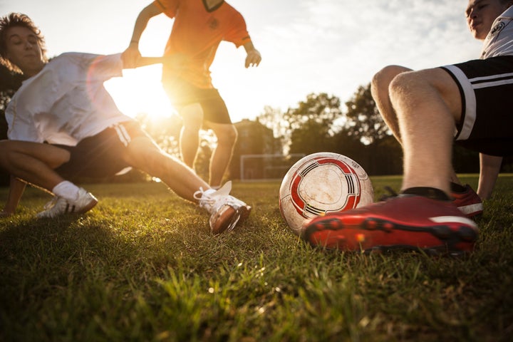 Sliding tackle on soccer pitch Westend61 via Getty Images