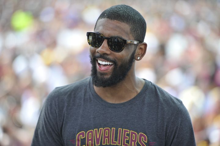 Kyrie Irving of the Cleveland Cavaliers speaks to the fans during the Cleveland Cavaliers Victory Parade.