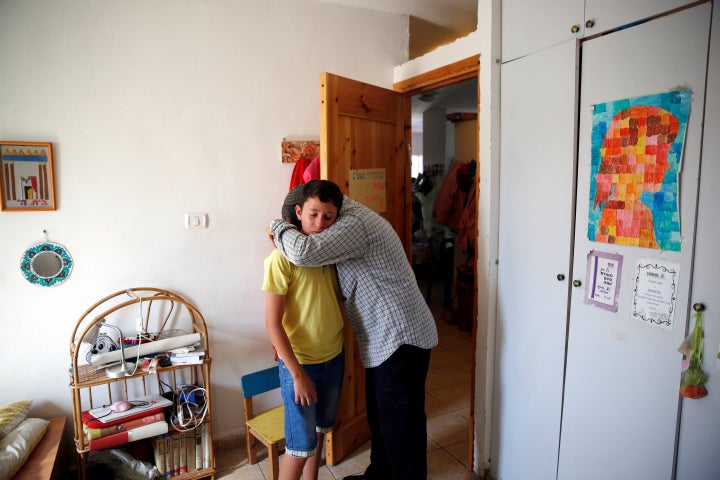 Relative comfort each other in Ariel's bedroom. Her attacker was shot dead and the Israeli premier said his home would b