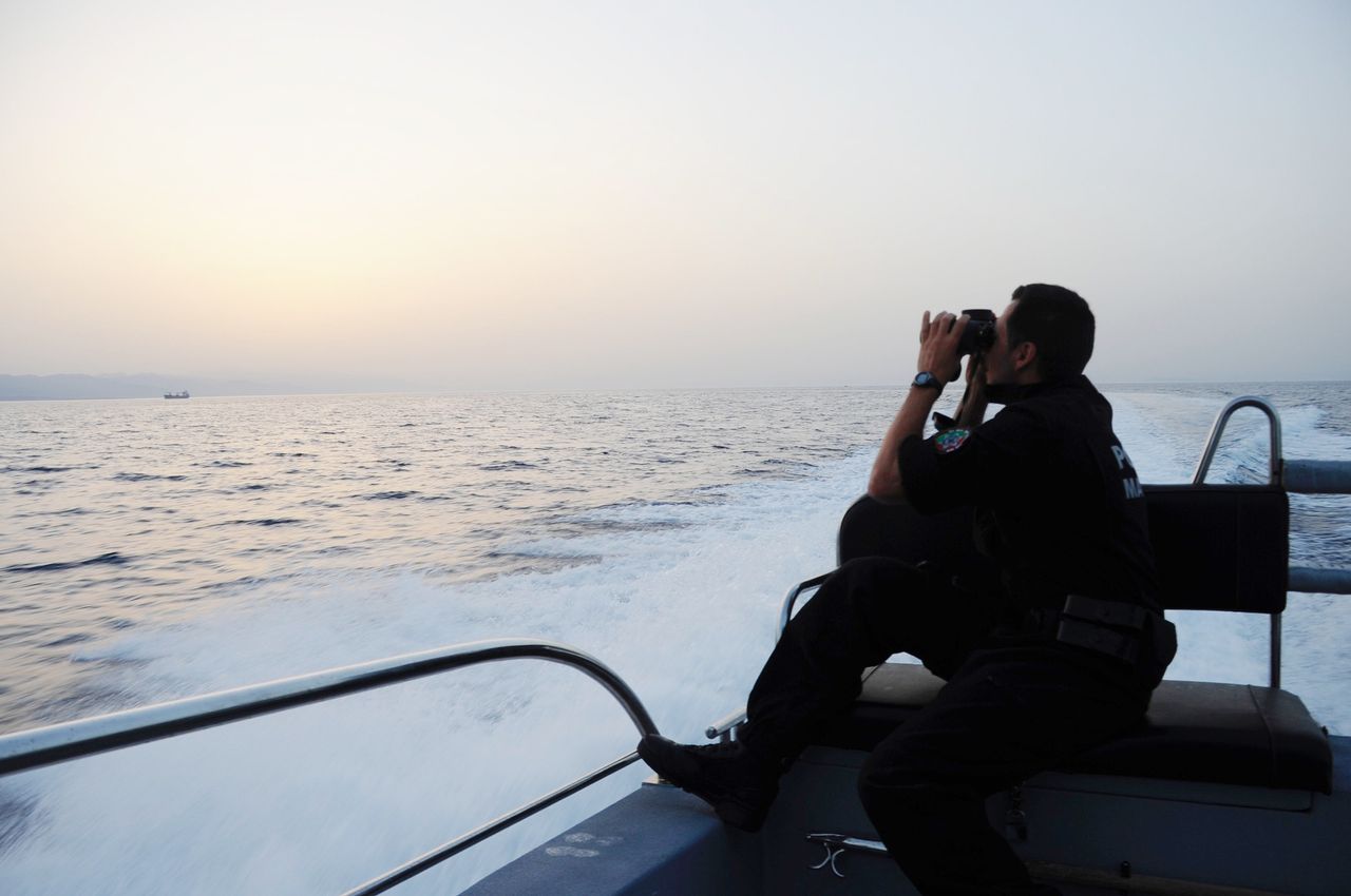 Ricardo Pereira uses binoculars to get a better look. Rodrigues praises his crew's "falcon eye."