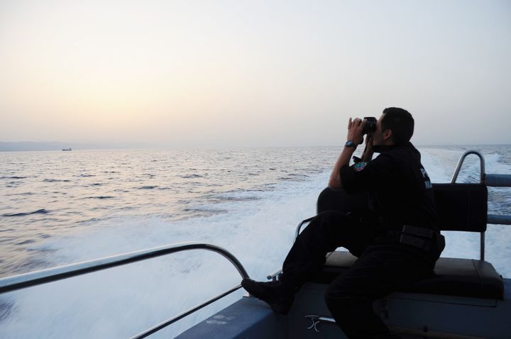 Ricardo Pereira uses binoculars to get a better look. Rodrigues praises his crew's