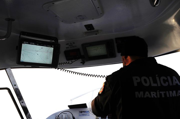 Capt. Carlos Rodrigues pages the Hellenic Coast Guard after spotting a raft on the boat's radar.
