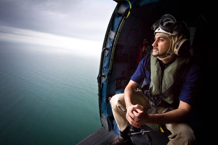 In 2015, following the crash of Air Asia Flight 8501, Muhammad Lila was the only US broadcast network correspondent to gain access to the US Navy ships searching for survivors. In this photo, he and producer Matthew McGarry survey the debris from above.
