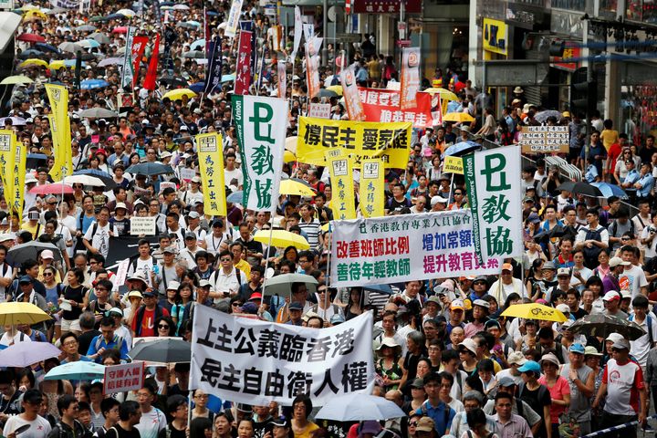Pro-democracy protesters take part in a march on the day marking the 19th anniversary of Hong Kong's handover to Chinese sovereignty from British rule, in Hong Kong July 1, 2016.